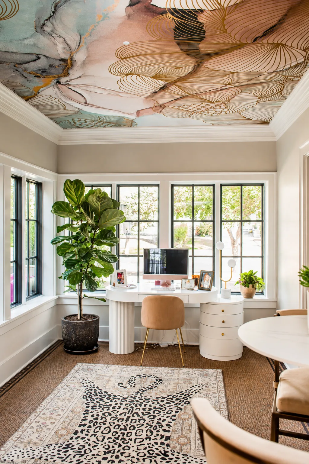 Home office framed by crisp white trim and dark window finishes