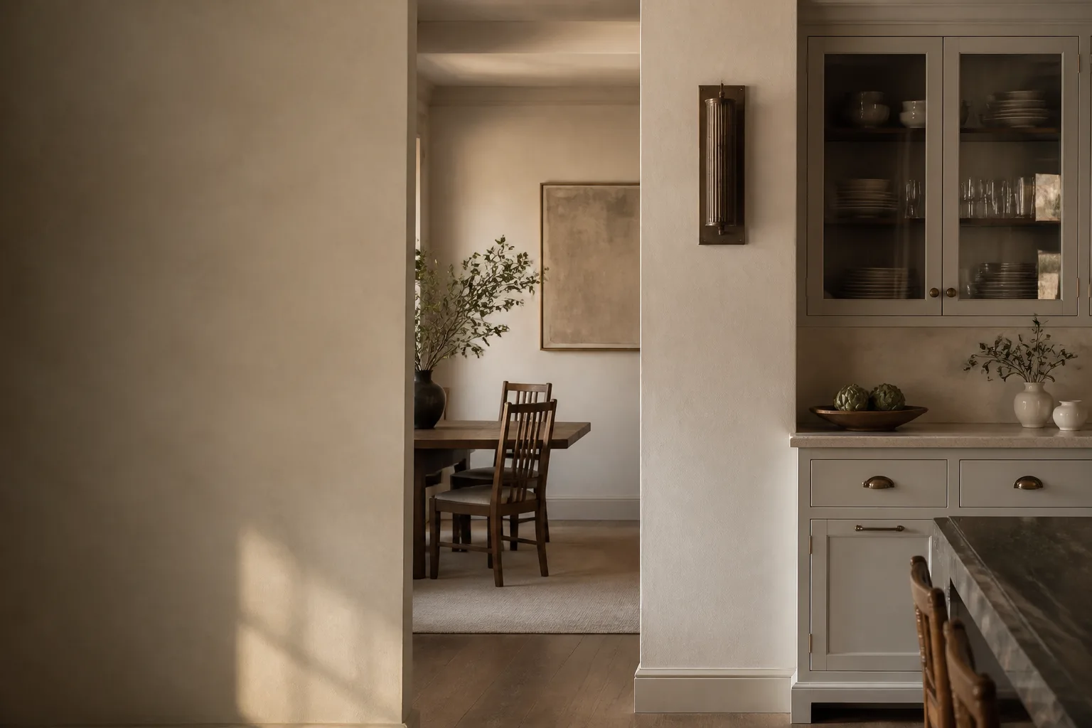 Warm plaster-style wall finish beside painted cabinetry